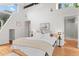 Primary bedroom featuring a sloped ceiling, ensuite bath and large window with natural light at 360 S Ogden St, Denver, CO 80209