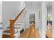Bright entryway showcasing a staircase with wood and white trim, leading to the upper level at 360 S Ogden St, Denver, CO 80209