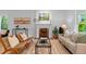Comfortable living room showcasing a fireplace, hardwood floors, and neutral decor at 360 S Ogden St, Denver, CO 80209