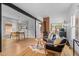 Open-concept living space with hardwood floors, exposed brick, and stylish decor at 360 S Ogden St, Denver, CO 80209
