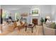 Bright living room featuring hardwood floors, a decorative fireplace, and elegant furnishings at 360 S Ogden St, Denver, CO 80209