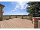 The house's deck area showcases brick pillars and views of the surrounding golf course at 6772 Vista Lodge Loop, Castle Pines, CO 80108