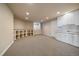 Finished basement with built-in shelving, utility sink, and plenty of storage space at 6772 Vista Lodge Loop, Castle Pines, CO 80108