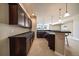 Basement with bar area featuring cabinets, counter space and an open floorplan at 6772 Vista Lodge Loop, Castle Pines, CO 80108