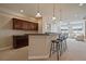 Spacious basement bar with bar-height seating, custom cabinetry, and open layout at 6772 Vista Lodge Loop, Castle Pines, CO 80108