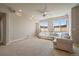 Large basement features plush carpet, neutral paint, and lots of natural light from the two windows at 6772 Vista Lodge Loop, Castle Pines, CO 80108