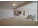 Finished basement with open floor plan, bar seating, and staircase to upper level at 6772 Vista Lodge Loop, Castle Pines, CO 80108