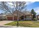 Charming home exterior with a two-car garage, landscaped yard, and inviting front porch at 6772 Vista Lodge Loop, Castle Pines, CO 80108