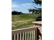 This scenic view from the home includes lush greenery, rolling hills, and distant mountain views at 6772 Vista Lodge Loop, Castle Pines, CO 80108
