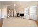 Open-concept living area with a fireplace, built-in shelving, and hardwood floors at 6772 Vista Lodge Loop, Castle Pines, CO 80108
