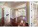 Spacious living room with hardwood floors, ample lighting, and elegant architectural details at 6772 Vista Lodge Loop, Castle Pines, CO 80108