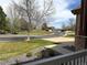 Street view of a neighborhood featuring lush lawns, mature trees, and well-maintained homes at 6772 Vista Lodge Loop, Castle Pines, CO 80108