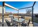 Backyard patio features stylish seating, an outdoor grill, and a privacy fence at 19658 E Vassar Dr, Aurora, CO 80013