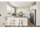 Modern kitchen featuring stainless steel appliances, granite countertops, and ample cabinet space at 19658 E Vassar Dr, Aurora, CO 80013