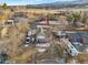 An aerial view of the property showing the house, backyard, surrounding neighborhood and nearby amenities at 14050 W 8Th Ave, Golden, CO 80401