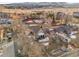Aerial view of a property showcasing the house, yard, surrounding neighborhood, and proximity to amenities at 14050 W 8Th Ave, Golden, CO 80401