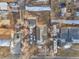 An aerial view of a house, with multiple cars parked around and a boat sitting beside the house at 14050 W 8Th Ave, Golden, CO 80401