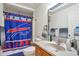 View of a bathroom with a single sink vanity, toilet, and Buffalo Bills themed shower curtain at 14050 W 8Th Ave, Golden, CO 80401
