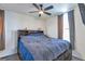 Comfortable bedroom with a large bed, ceiling fan, and neutral decor at 14050 W 8Th Ave, Golden, CO 80401