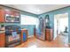 Well-lit kitchen boasts stainless steel appliances, granite countertops, and blue accent wall at 14050 W 8Th Ave, Golden, CO 80401