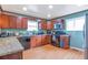 Bright, updated kitchen showcasing granite countertops, stainless steel appliances, and wood cabinetry at 14050 W 8Th Ave, Golden, CO 80401