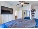 Serene bedroom with a mirrored closet, ceiling fan, and view of dining room at 14050 W 8Th Ave, Golden, CO 80401