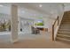 Spacious finished basement features a large entertainment area, ample lighting, and easy access to the stairs at 14916 E Crestridge Pl, Centennial, CO 80015