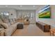 Finished basement area featuring a large sectional sofa, entertainment center, and recessed lighting at 14916 E Crestridge Pl, Centennial, CO 80015