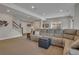 Finished basement offering a sectional sofa, and a staircase leading to the upper level of the home at 14916 E Crestridge Pl, Centennial, CO 80015