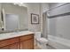 Bathroom features a shower and tub combo with tile surround, and a vanity with modern fixtures at 14916 E Crestridge Pl, Centennial, CO 80015