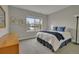 Comfortable bedroom offers great natural light from the window, and calm color scheme at 14916 E Crestridge Pl, Centennial, CO 80015