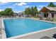 Community pool with lounge chairs and umbrellas offers relaxation and recreation at 14916 E Crestridge Pl, Centennial, CO 80015