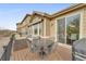 Relaxing deck with outdoor seating and dining table providing views for a serene outdoor experience at 14916 E Crestridge Pl, Centennial, CO 80015