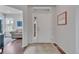Welcoming foyer with hardwood floors, a bright entryway, and a glimpse into the living area at 14916 E Crestridge Pl, Centennial, CO 80015