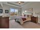 Inviting bedroom with a large window, neutral color scheme, and comfortable furnishings at 14916 E Crestridge Pl, Centennial, CO 80015