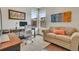Bright home office features a large desk, comfortable seating, and multiple windows for natural light at 14916 E Crestridge Pl, Centennial, CO 80015