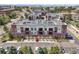 Brick building with balconies, a parking lot, and a beautiful location at 307 Inverness S Way # 307, Englewood, CO 80112
