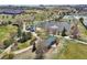 Scenic aerial view of the community lake, green space, and covered picnic tables at 307 Inverness S Way # 307, Englewood, CO 80112