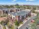 An aerial view showing a beautiful building, balcony, parking, and landscaping at 307 Inverness S Way # 307, Englewood, CO 80112