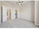 Bedroom with ceiling fan and doors to other rooms at 307 Inverness S Way # 307, Englewood, CO 80112