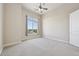 Bedroom with ceiling fan and large window with outdoor view at 307 Inverness S Way # 307, Englewood, CO 80112