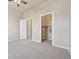 Bedroom with ceiling fan and doors to other rooms at 307 Inverness S Way # 307, Englewood, CO 80112