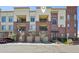 Condo exterior featuring garages and private entrances to the homes above at 307 Inverness S Way # 307, Englewood, CO 80112