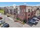 Multi-story condo building with brick accents, balconies, and loading zone at 307 Inverness S Way # 307, Englewood, CO 80112