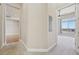 Hallway with carpet floors leading to another room with hardwood floors at 307 Inverness S Way # 307, Englewood, CO 80112