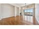 Bright living room features a fireplace, wood floors, and a balcony with sliding glass doors for outdoor access at 307 Inverness S Way # 307, Englewood, CO 80112