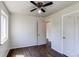 Bedroom featuring hardwood floors, natural light from the window, and a ceiling fan at 3311 S Eudora St, Denver, CO 80222