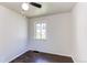 A bright bedroom featuring light colored walls and beautiful hardwood floors at 3311 S Eudora St, Denver, CO 80222