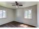 Bedroom featuring light colored walls, hardwood floors and a ceiling fan at 3311 S Eudora St, Denver, CO 80222