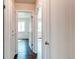 Hallway with multiple doorways that lead into other rooms of the home at 3311 S Eudora St, Denver, CO 80222